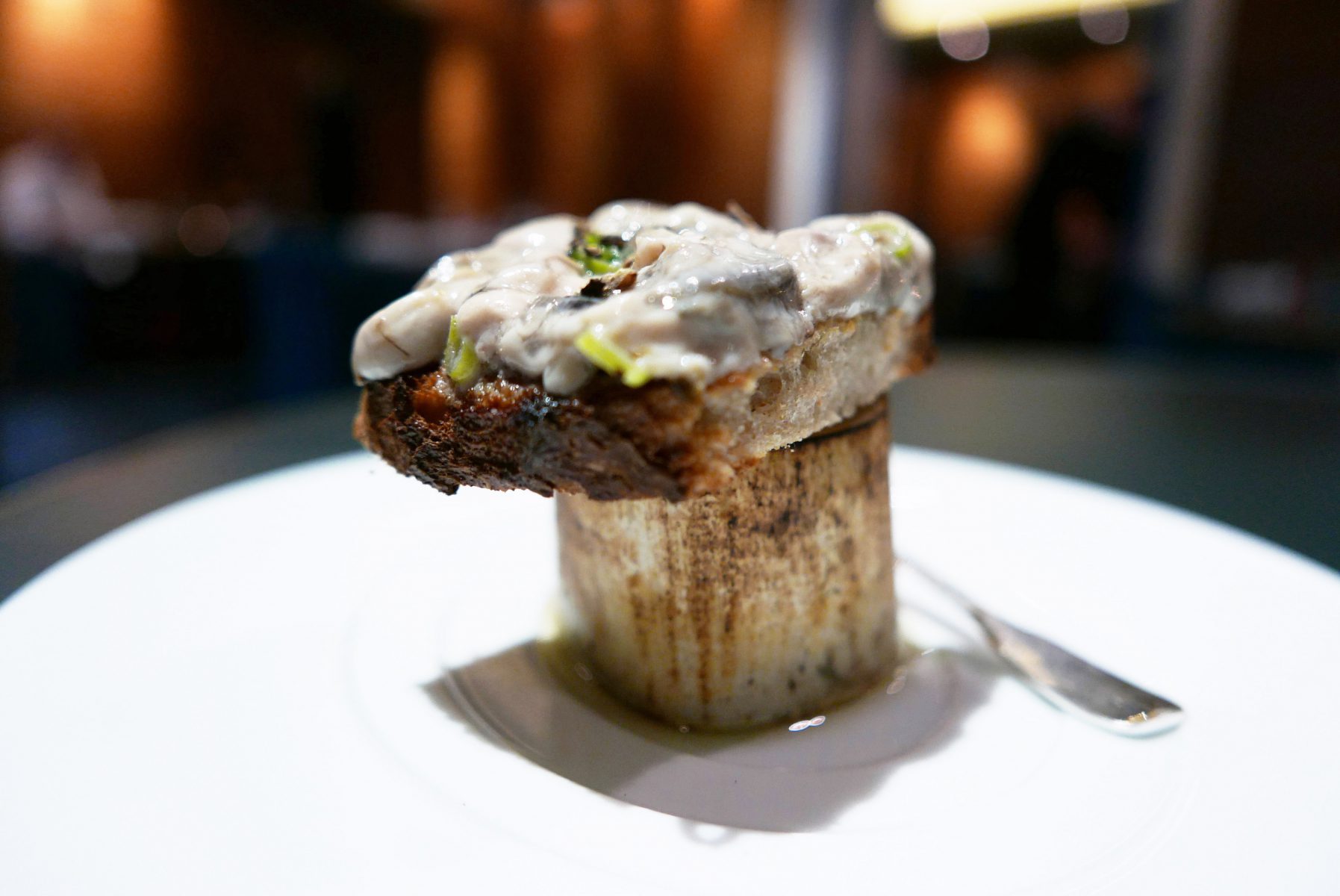 Oyster toast served on a bone with its marrow. You had to mix both ingredients . A-ma-zing