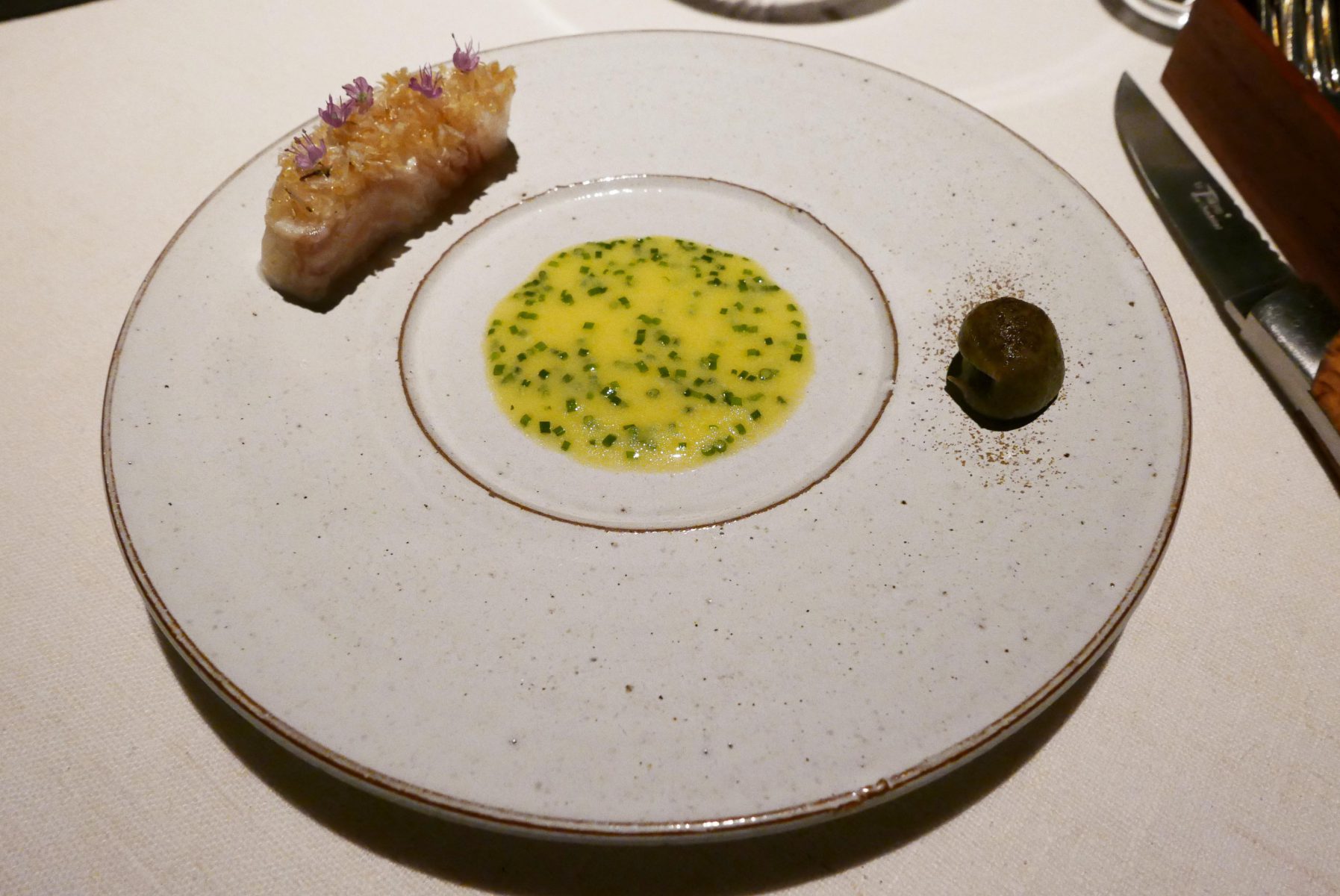 Slow baked turbot,toasted creme of brown algae,carp scales and just churned butter with bouillon of the bones