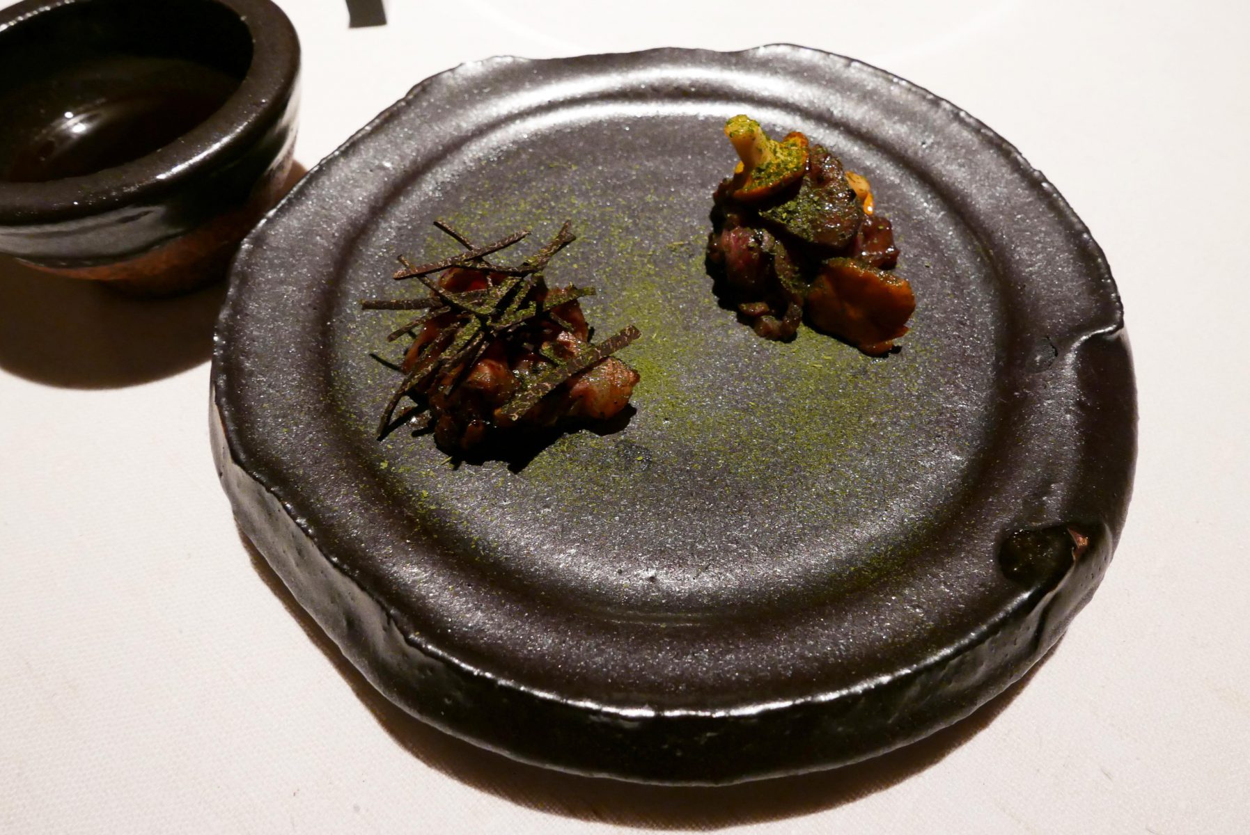 Kagoshima vs beef from Sweden with truffle ponzu,dried ramson and truffle in jus of grilled beef, fermented mushrooms