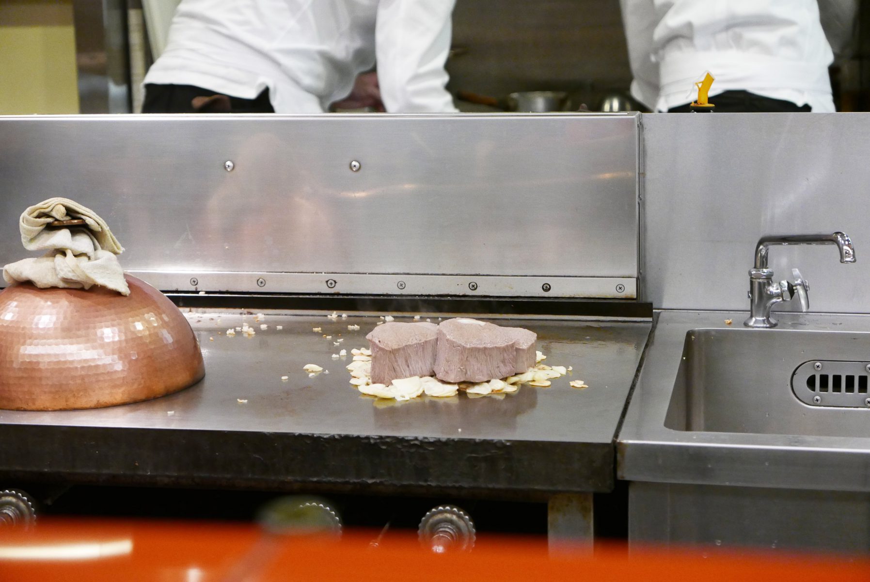 Tenderloin places on the bed of garlic