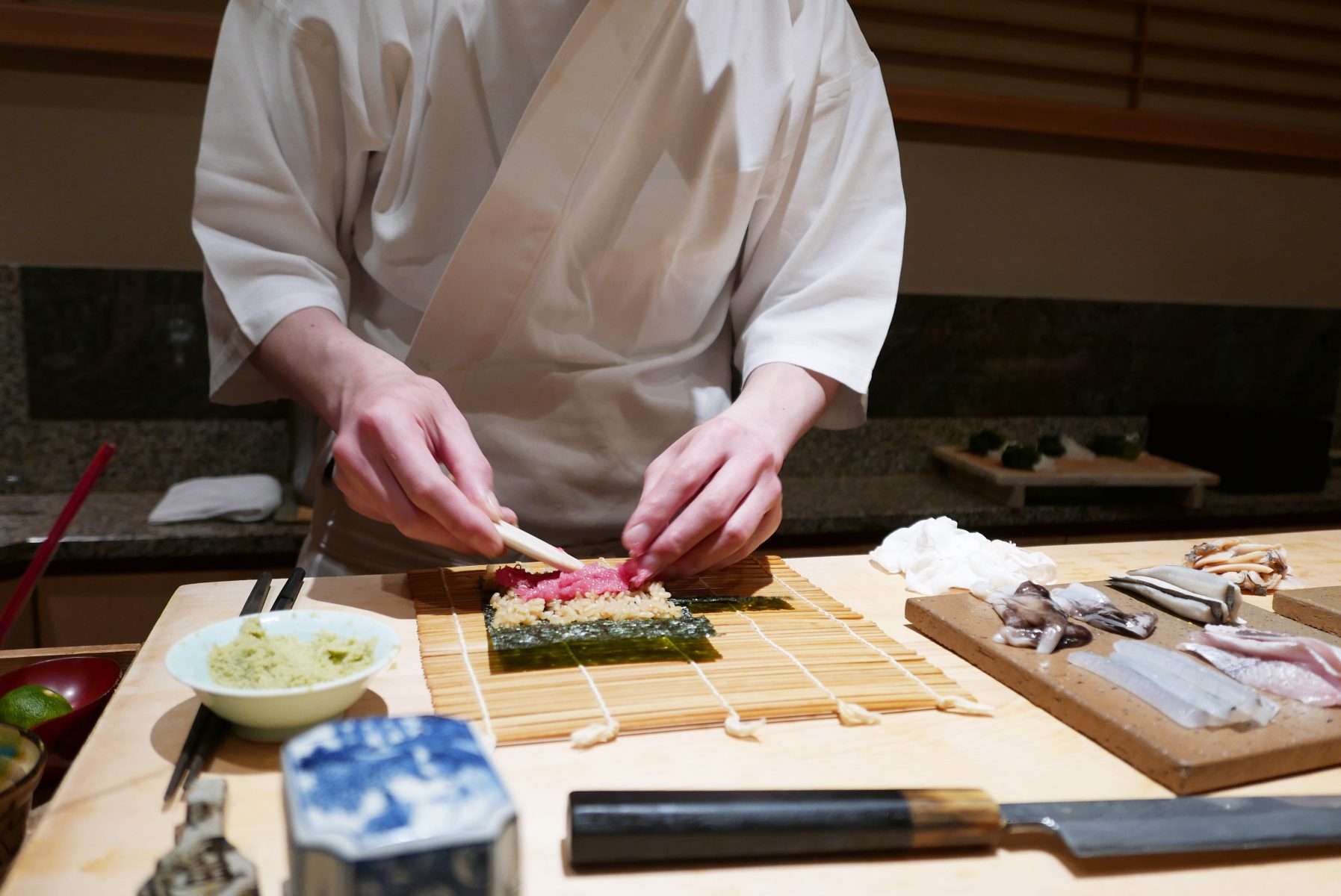 Sato-san making his signature tuna collar roll