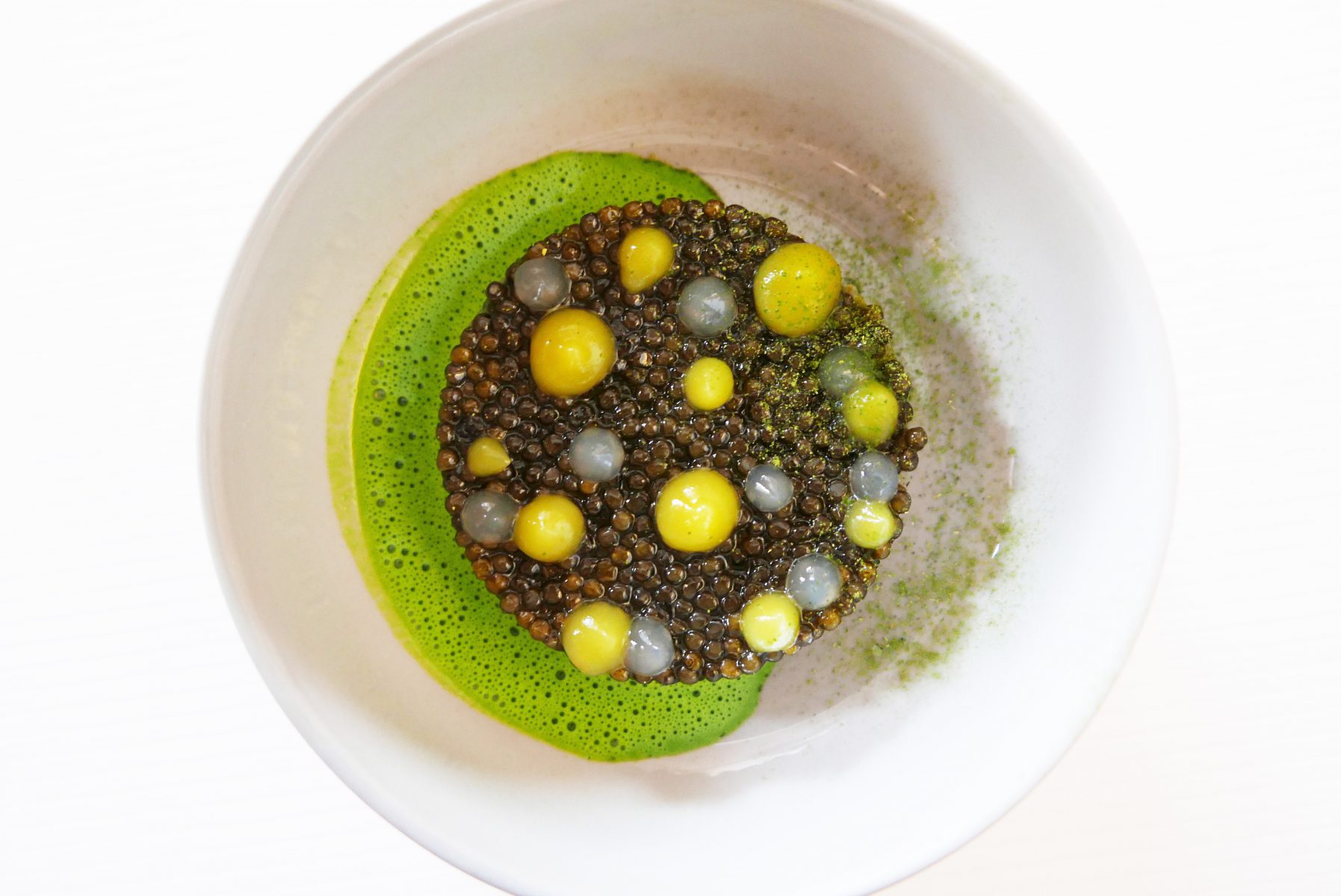 Caviar and raw langoustine with citrus fruit zest, gentian root and parsley