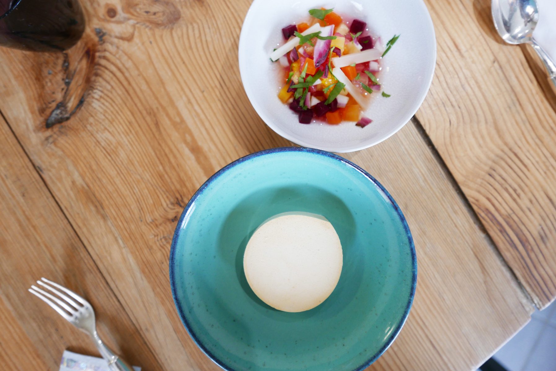 Cottage cheese with liquorice in chicory coffee shell, fruit, vegetable and herbs salad