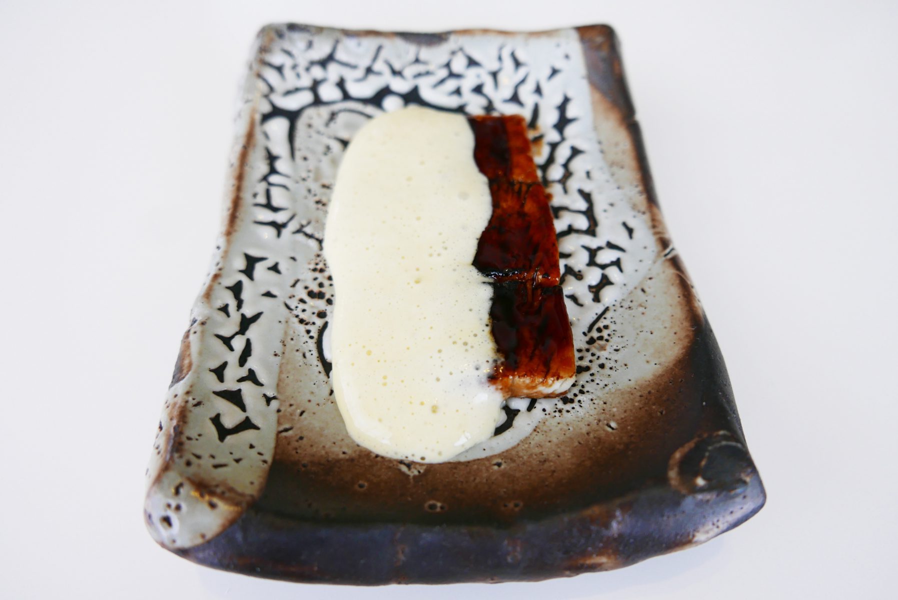 Flamed eel from Albufera and ginger emulsion