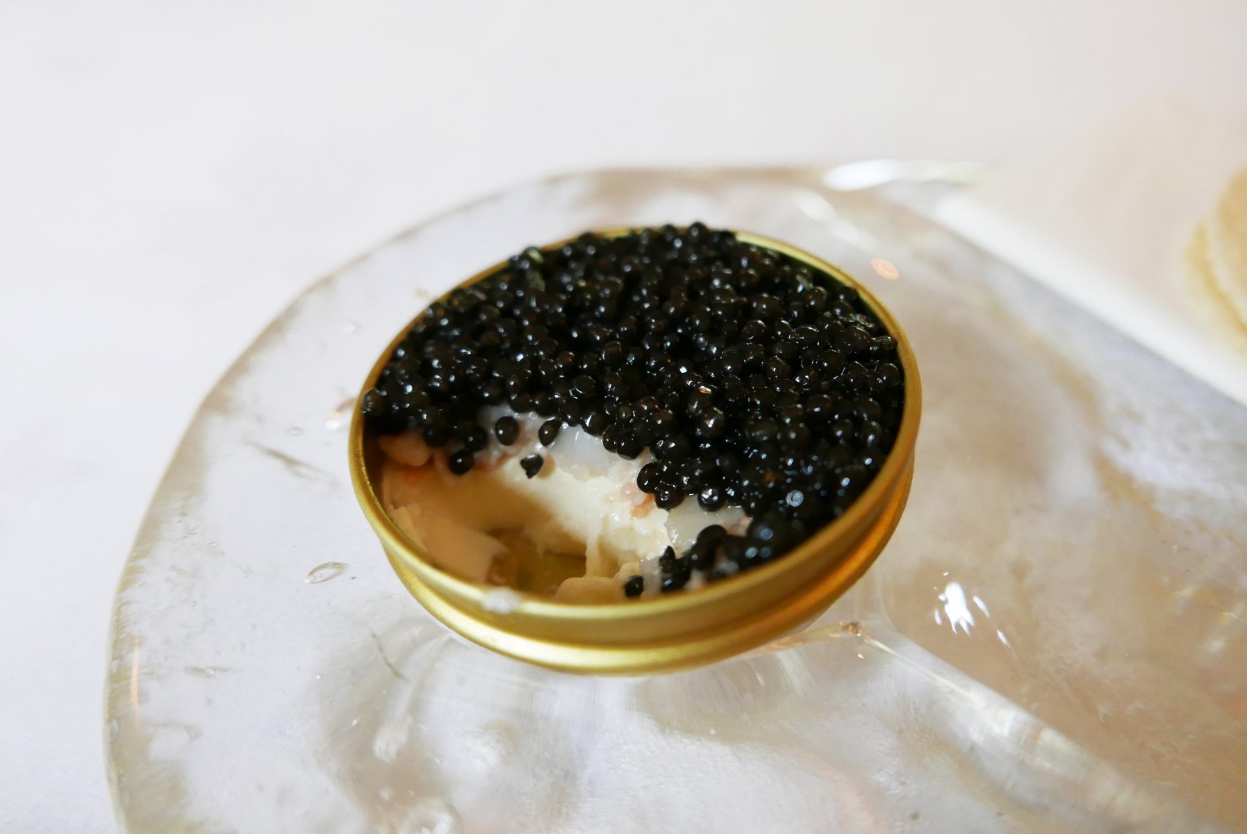 Caviar "en surprise" with langoustines and asparagus panna cotta