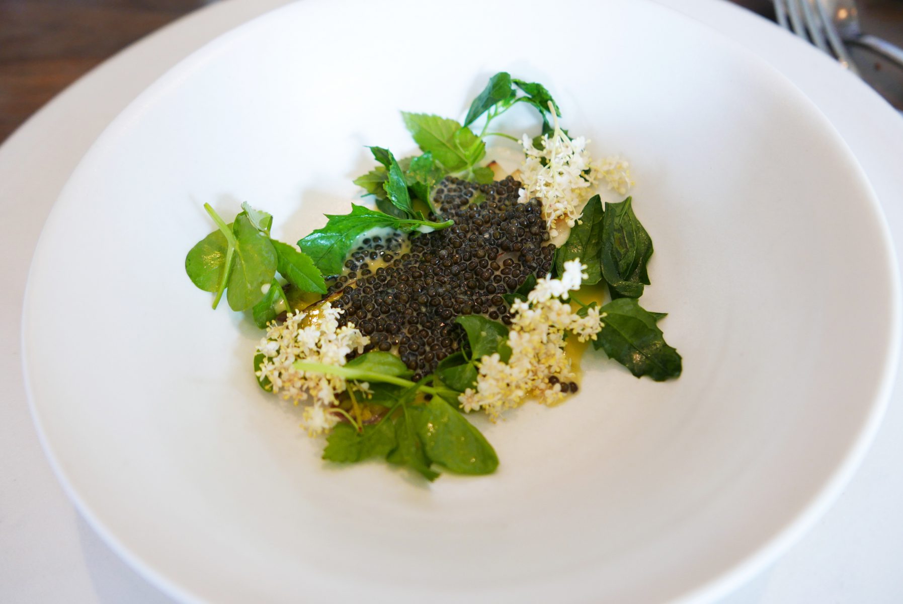 Cooked white asparagus with barley and caviar