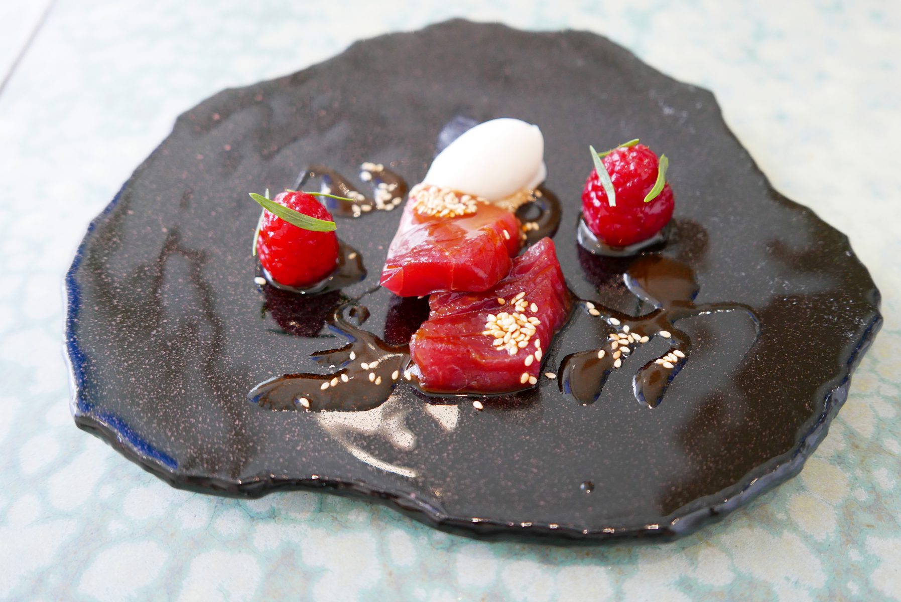 Tuna with marinated raspberries and sake-kasu