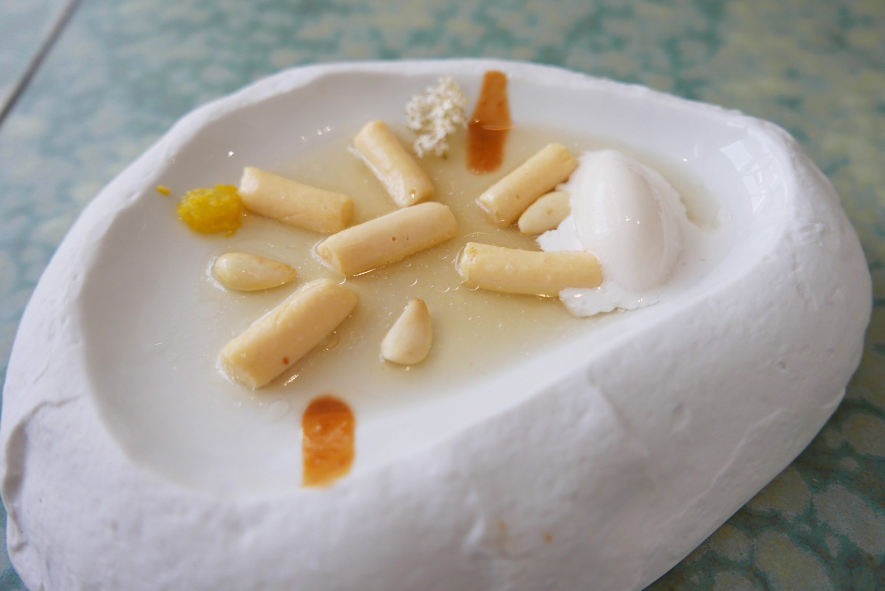 Almond cream gnocchi with elderflower and amber