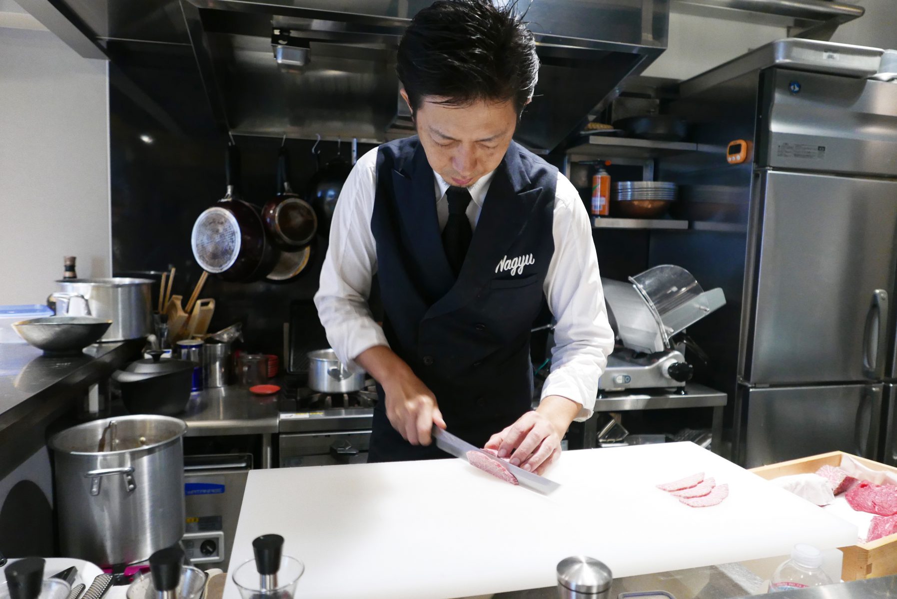 Chef slicing beef at Wagyu Mafia