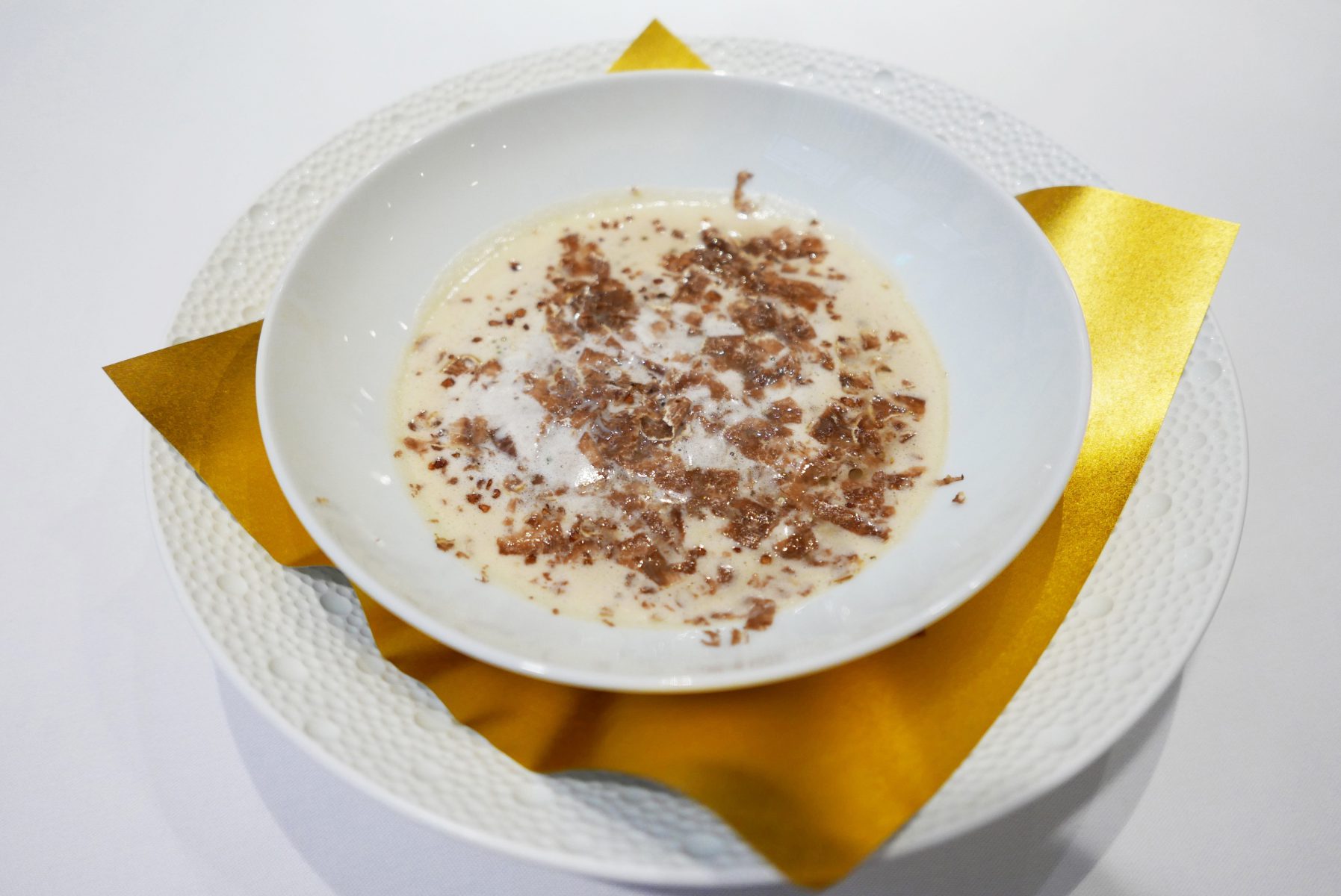 Onion soup with foie gras royale and white truffle by Bruno Menard at Les Saisons in Tokyo.