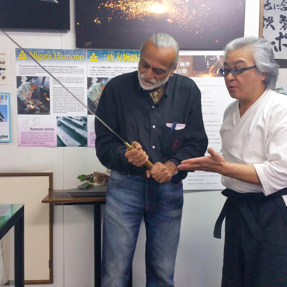 Jay Patel with master Toshihisa Yoshizawa holding a Katana, a Samurai sword 
