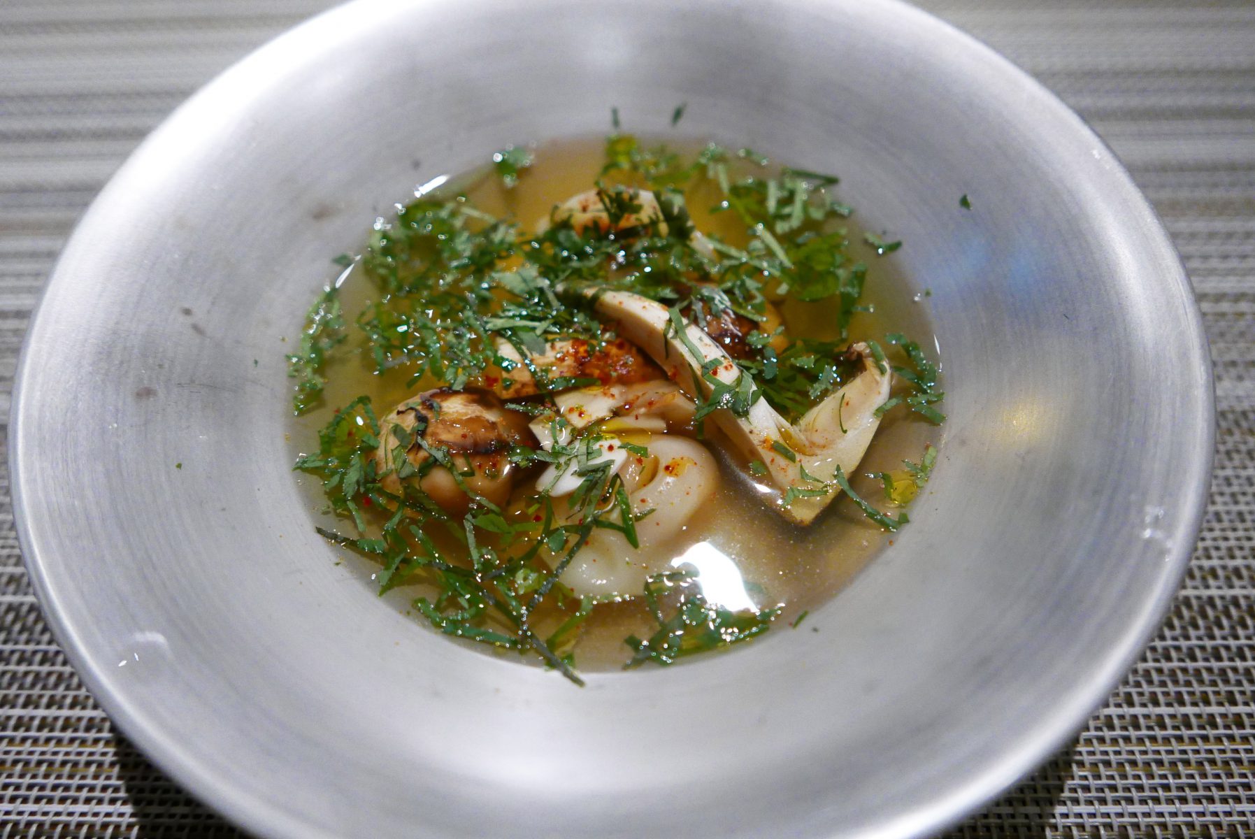 Foie gras ravioli with matsutake mushrooms in dashi broth