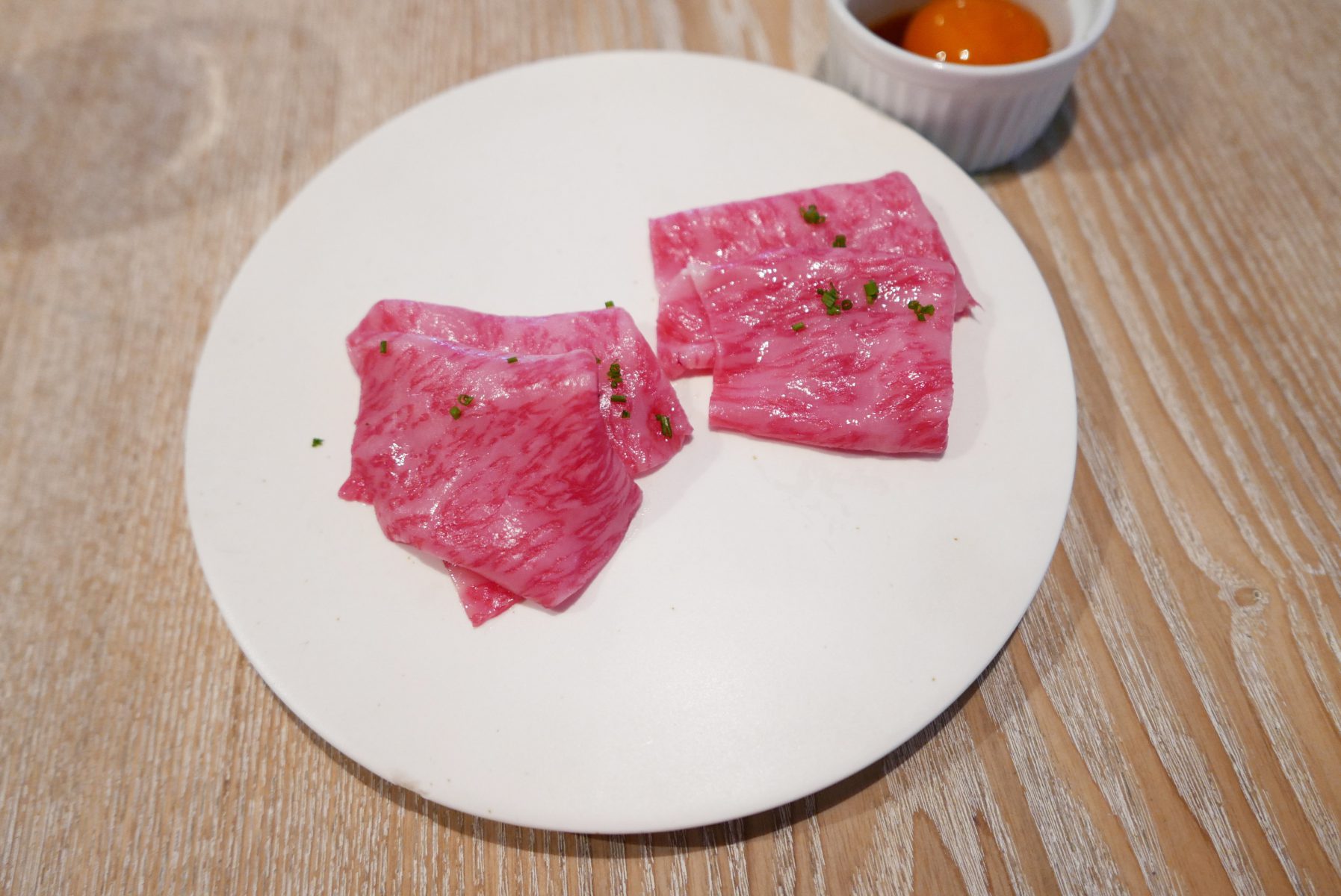 Miyazaki beef sashimi with soy cured egg yolk by Kentaro Nakahara at Anis collaboration, Tokyo.