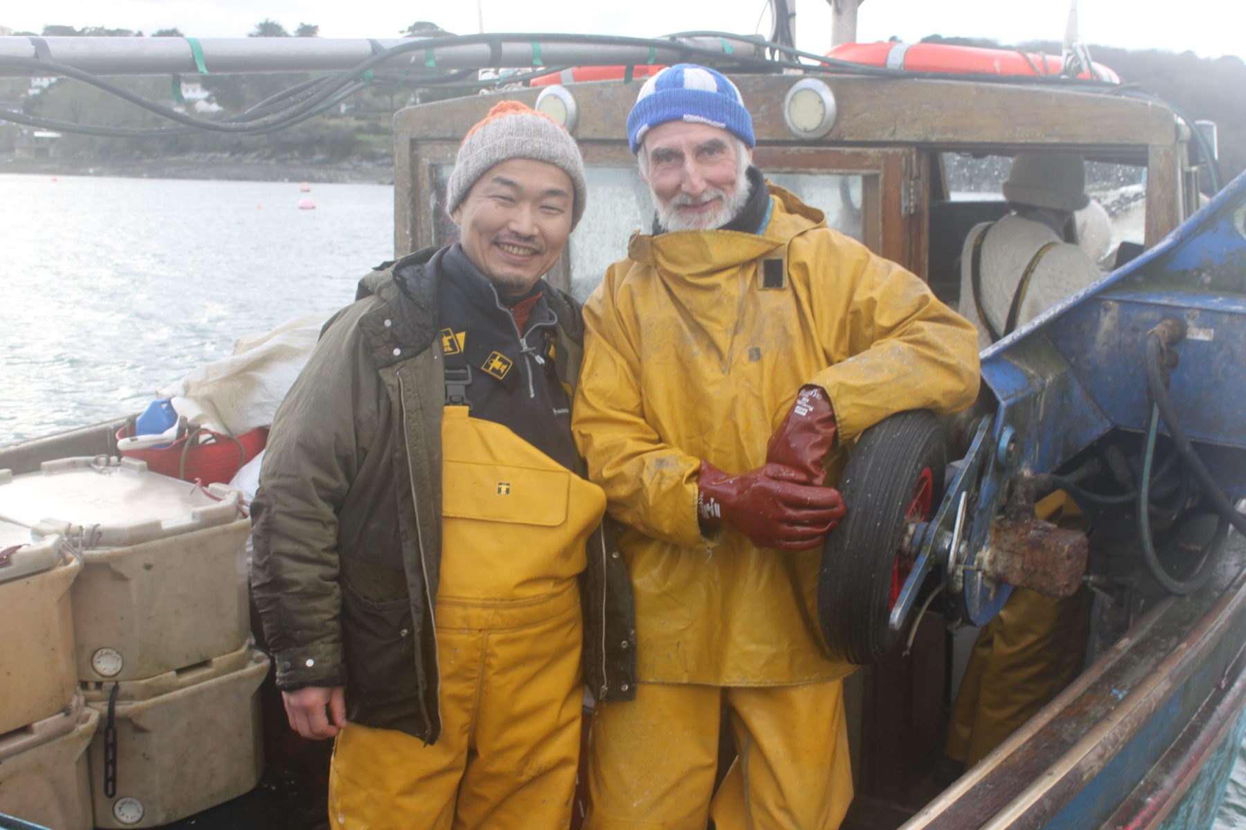 Yoshinori Ishii (left) while on a fishing trip