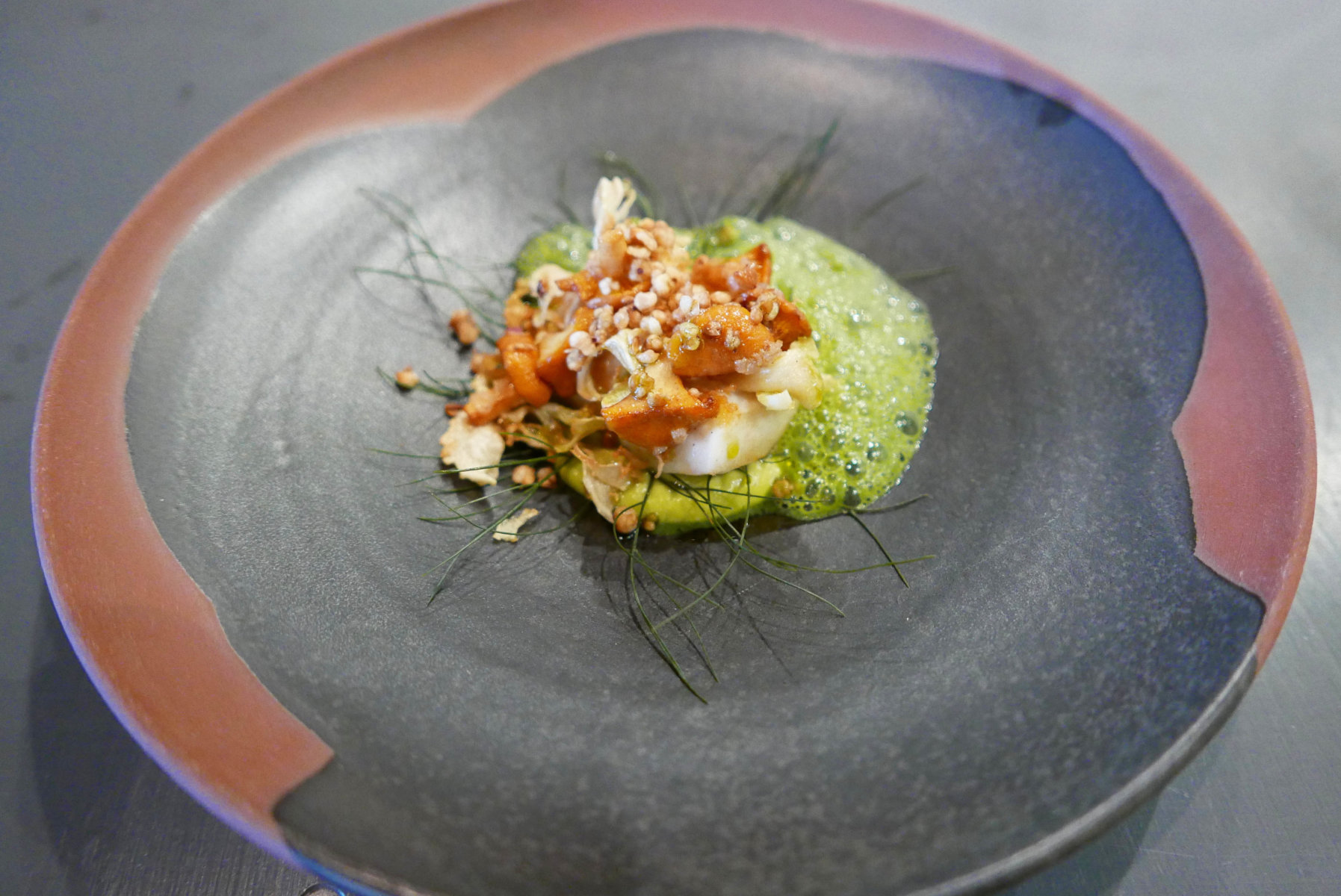 Pan fried turbot with cream of peas in pea juice,freid buckwheat,bronze fennel with chanterelles and cauliflower