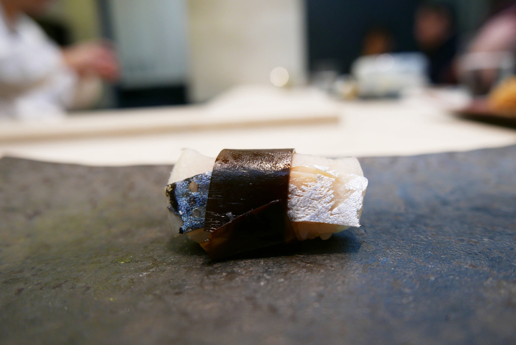 Mackerel with steamed konbu (in sugar, soy and vinegar)