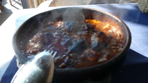 rice with artichokes, shrimps and cuttlefish cooked over charcoal