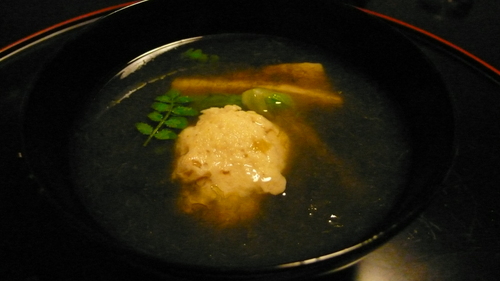 soup with a clam dumpling