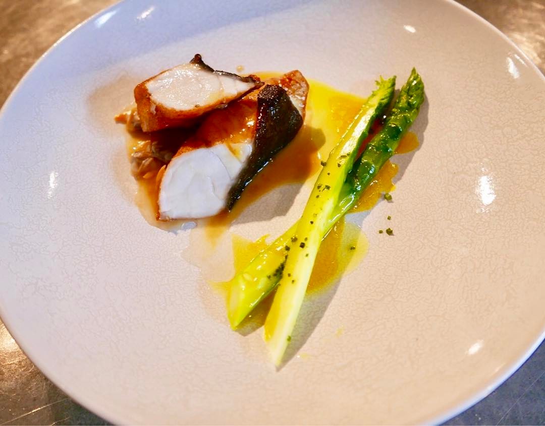 turbot, its head collagen sauce, first asparagus and egg yolk