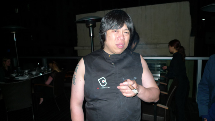 Alvin Leung hanging out with his guests and having a cigar.