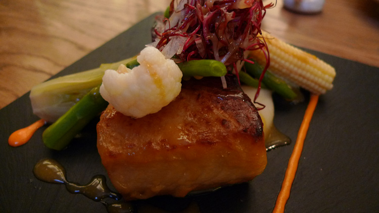 black cod marinated in white miso sauce, warm salad, with mini vegetables