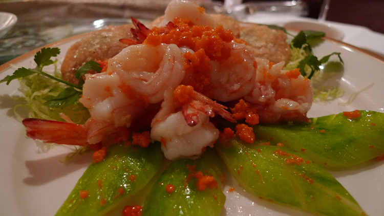 sautéed prawns and crab roe with golden fried pork ad crab meat puffs