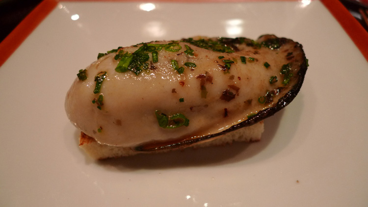 Grilled oyster on a white toast