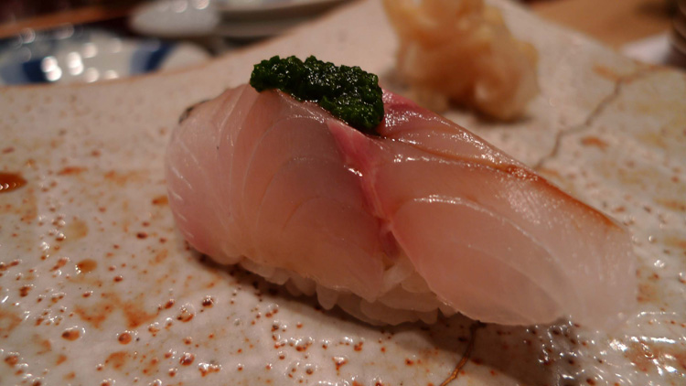 Horse mackerel with some seaweed on the top