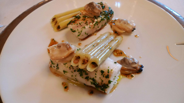 Thinly-sliced seabass with chopped parsley. Stuffed macaroni, clams prepared simply