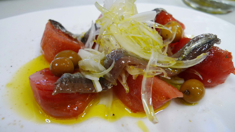 Tomato salad with onions,olives and anchovies