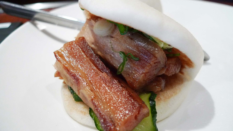 Steamed pork bun with hoisin, cucumbers and scallions