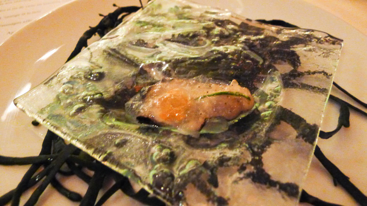 Iced poached oysters served in seawater jelly
