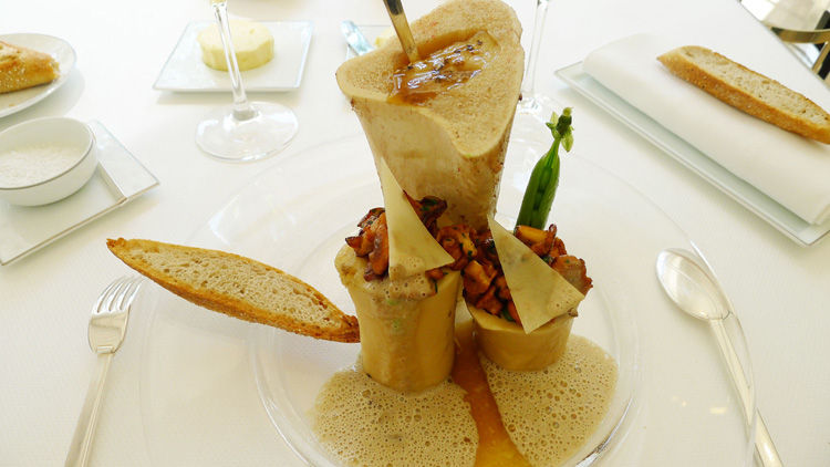 Bone marrow  prepared in two ways - grilled;  stuffed with simmered green peas and chanterelles.