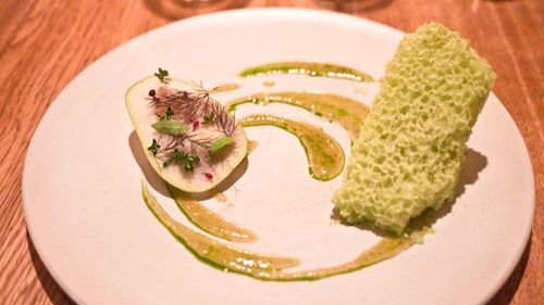 poached pear with a sponge of frozen and aerated pine