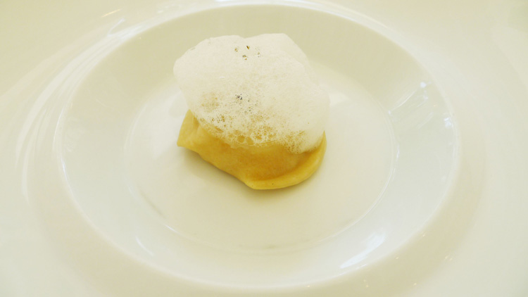  ravioli served with olive oil and "pepper and mint" broth foam