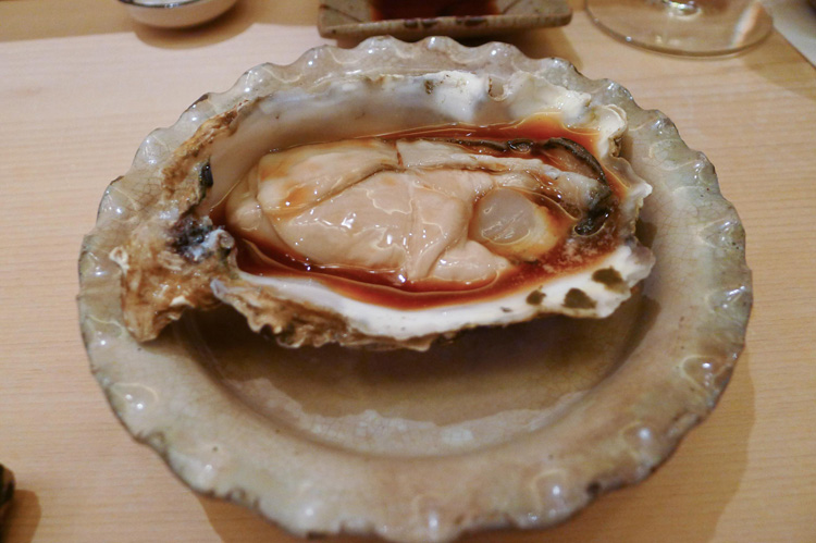 Fresh oyster with a dash of soy sauce