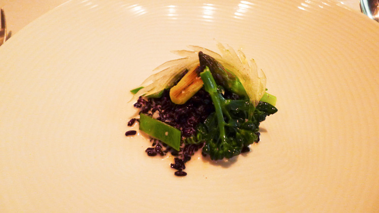 Crunchy black rice with green vegetables and Brazil nut, milk