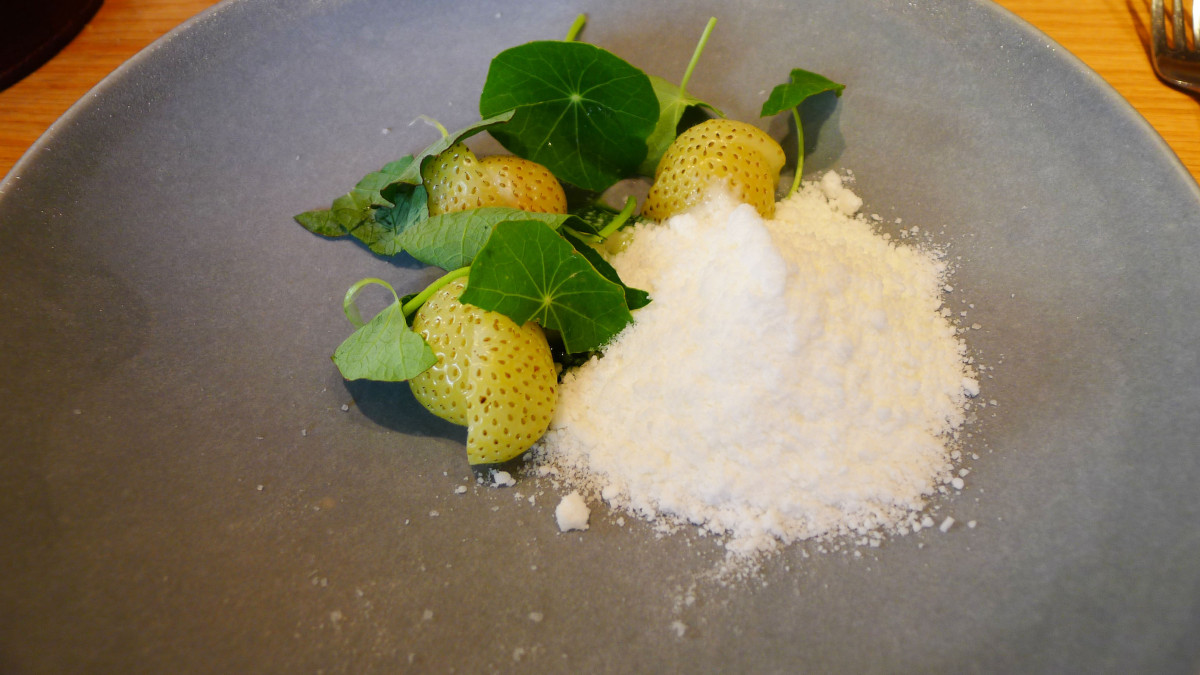 unripe, but cooked and still warm strawberry with cress sauce and buttermilk "snow"
