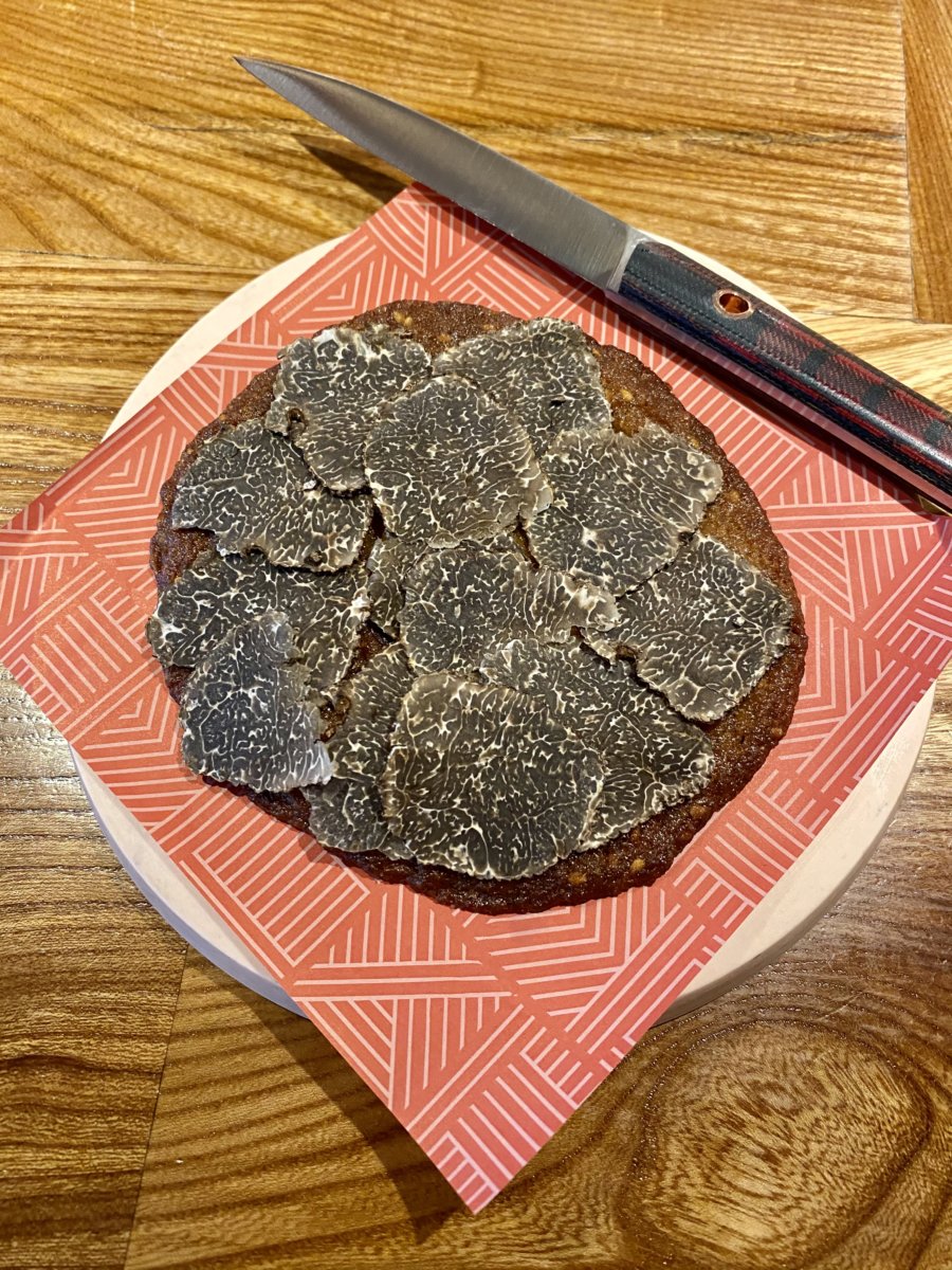 A cookie of homemade benne miso, dark chocolate and black truffle.