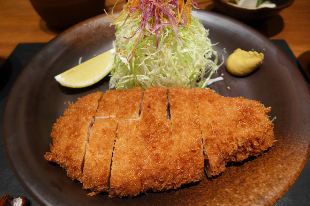 deep-fried pork cutlet served with finely shredded cabbage and Worcestershire sauce