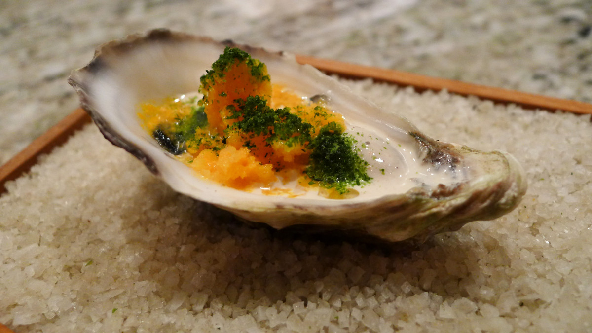 Oyster "62C" with Jersey cream, dried seaweed, sea buckthorn