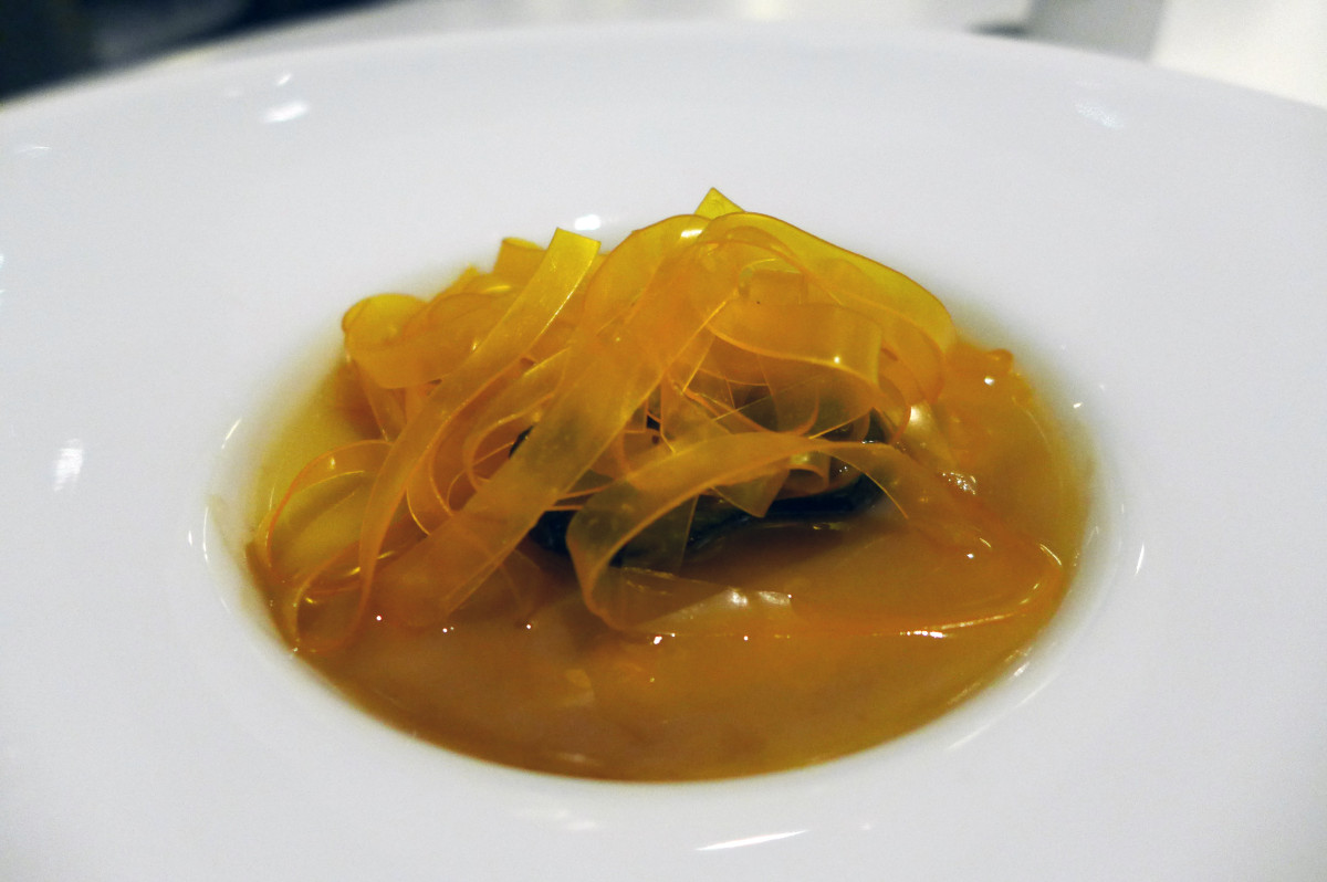 Egg yolk ( and nothing else) tagliatelle with whole black truffle and chicken extract