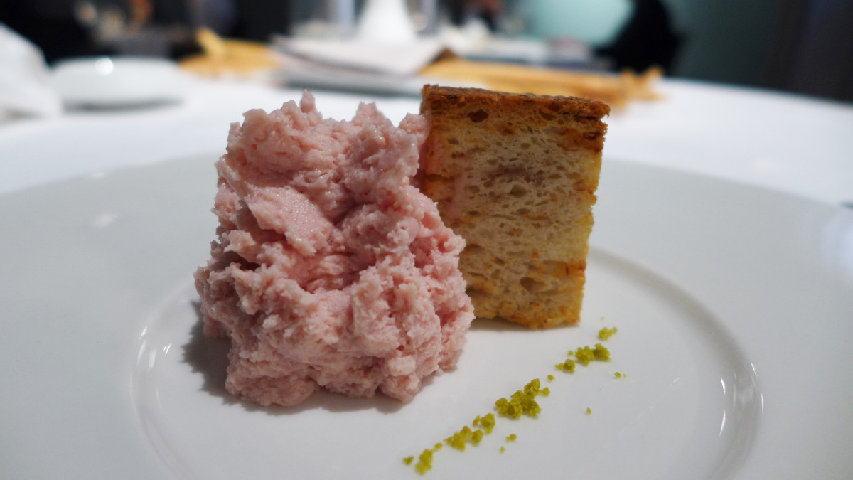 " Memories of a mortadella sandwich" - mortadella mousse with warm gnocco bread cube and some pistachios. Popular Italian snack deconstructed.