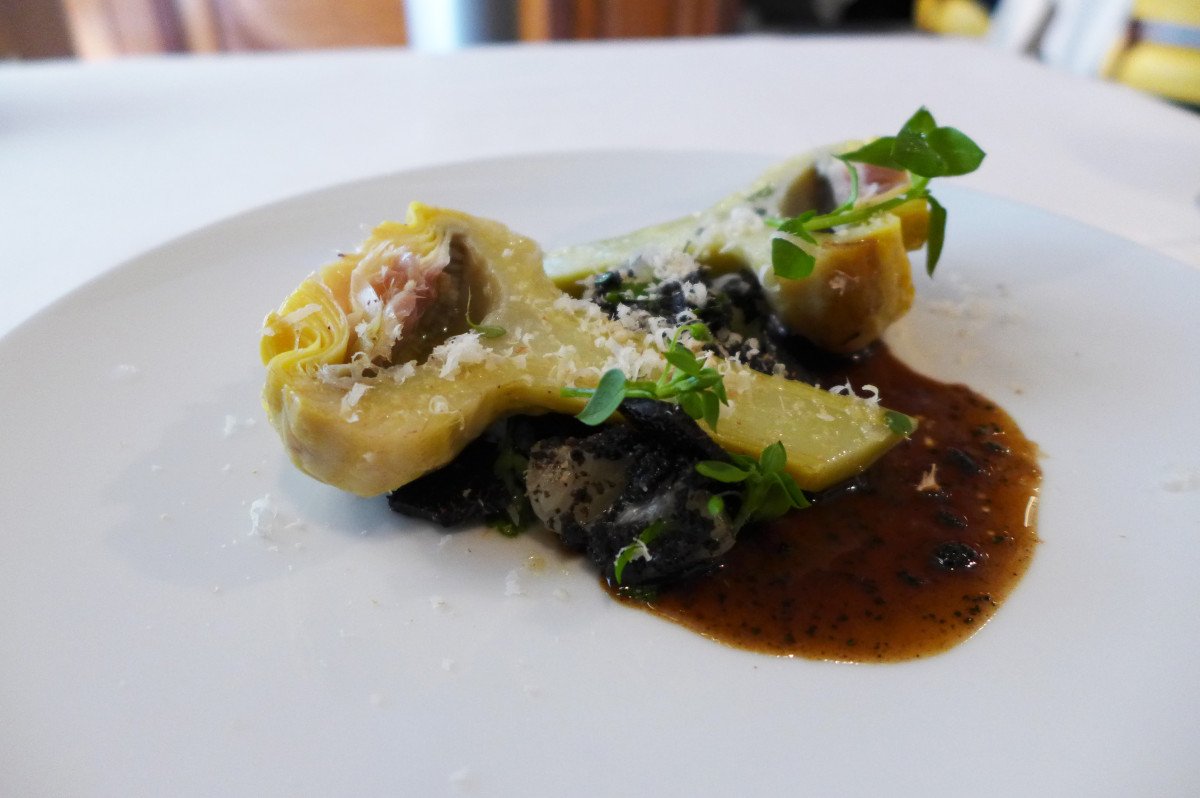 Artichokes à la Barigoule with black truffles, grapefruit, nuts and Parmesan