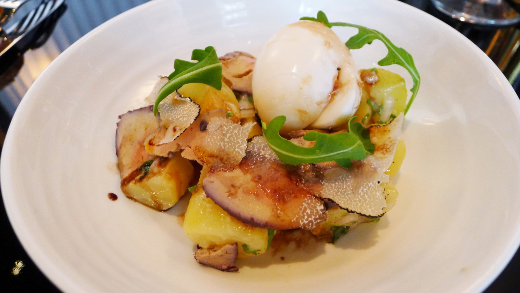 potatoes salad with foie gras, soft boiled egg and summer truffles shavings