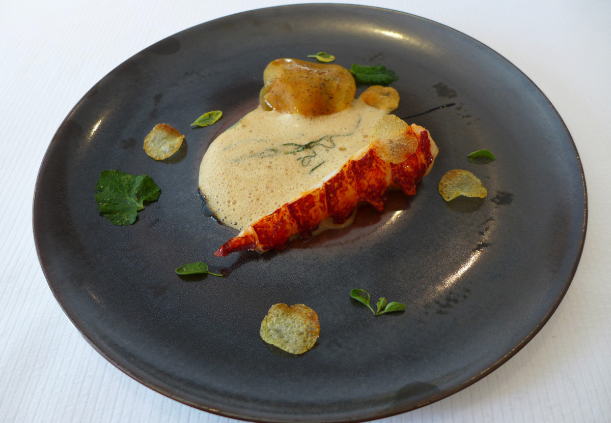 Lobster with paprika sauce, potato ravioli filled with crab, herbs from the garden. The dish was created in 1978 by Arnaud Lallement's father. My favorite dish from all what I've had.