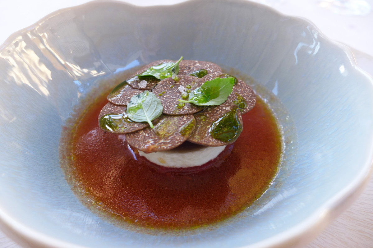 Tomato and mozzarella with Australian black truffles. ( much more flavorful than black French summer truffles)