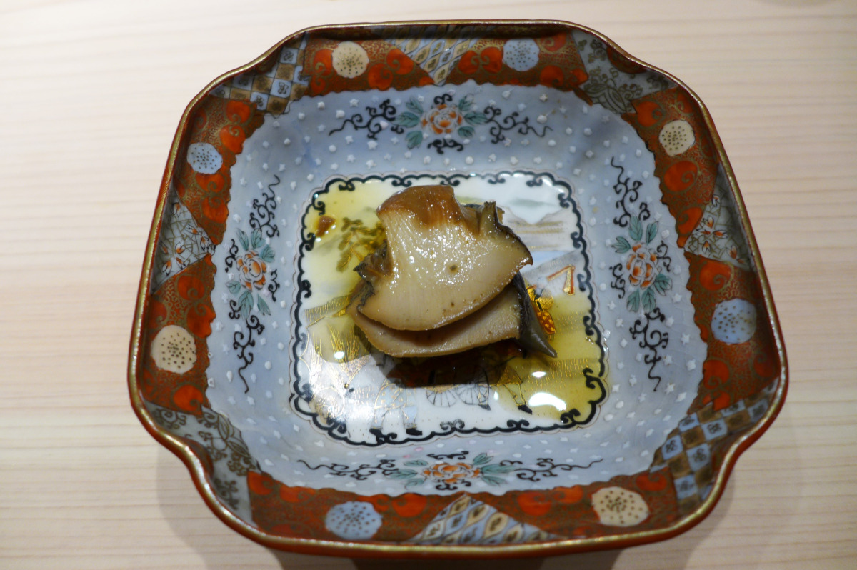 Steamed abalone from France, served in antique chinaware