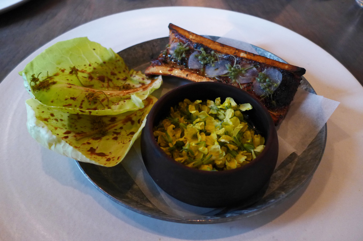 Roasted bone marrow, cabbage and nasturtium flowers