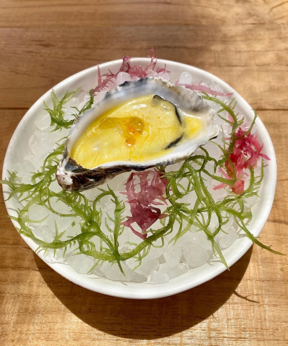 Marinated oyster with saffron and carrot sauce